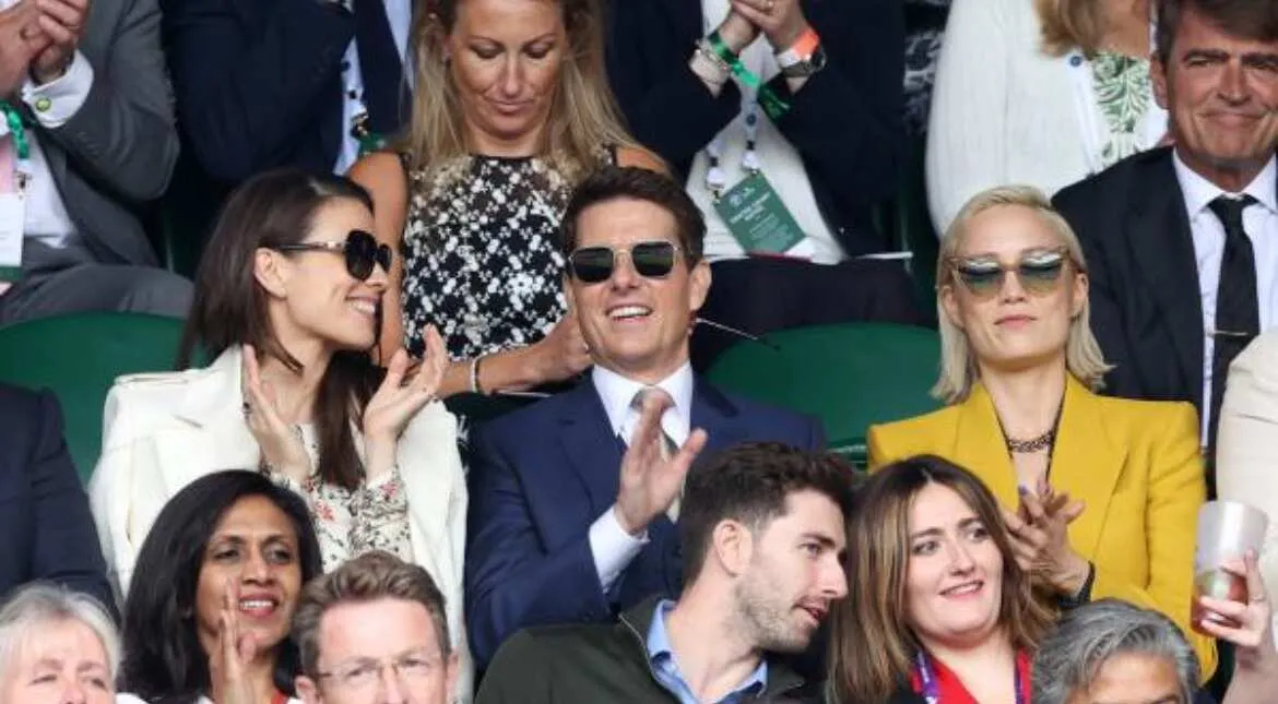 The trio seems to be having a gala time at the sporting event